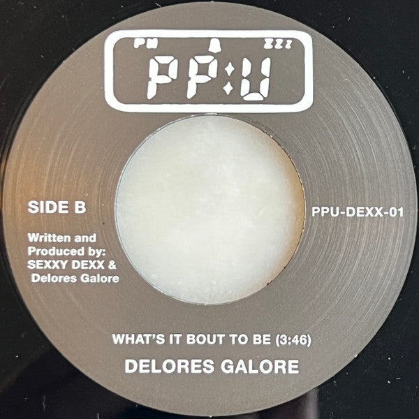 Sexxy Dexx / Delores Galore : Revelry / What's It Bout To Be (7", Single)