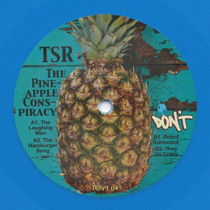 TSR – The Pineapple Conspiracy (12", Cornflower Blue Vinyl, Don't, 2026) Front Cover